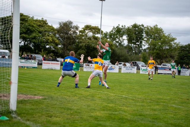 Vinny Frizzell fists a point vs Owenmore Gaels